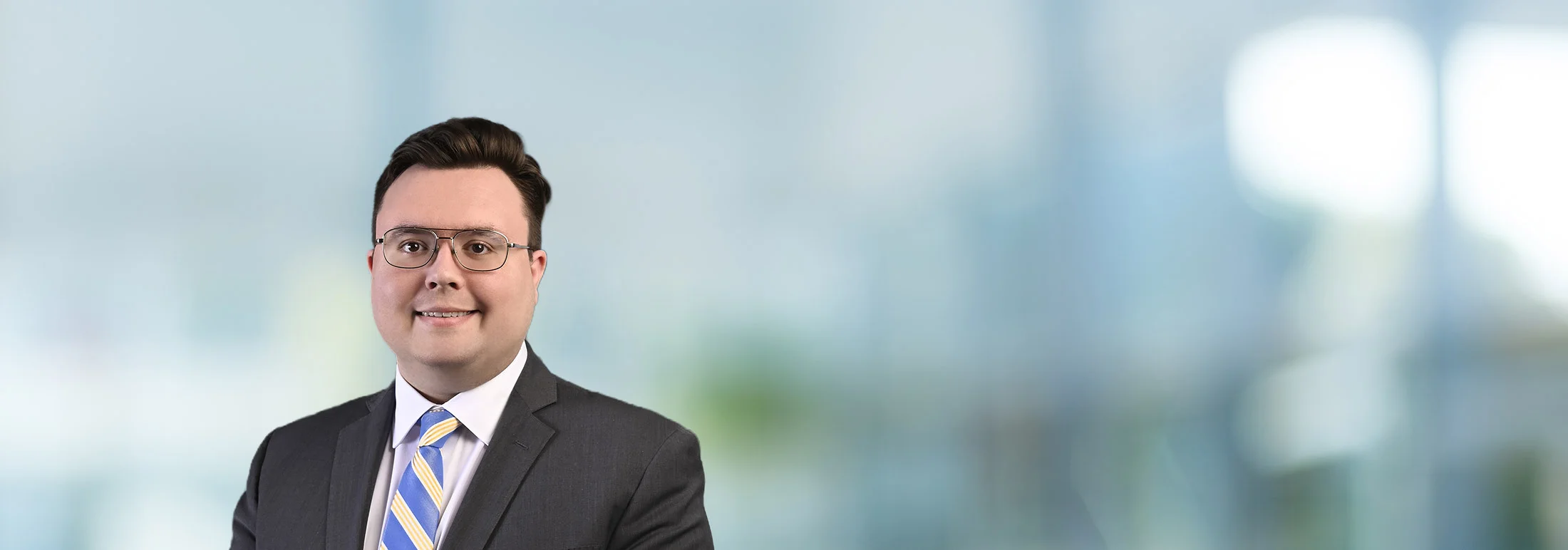 A photo of attorney Russell Brown against a softly blurred office background