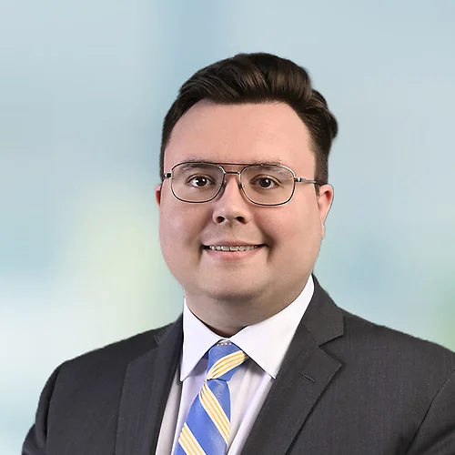 A photo of attorney Russell Brown against a softly blurred office background