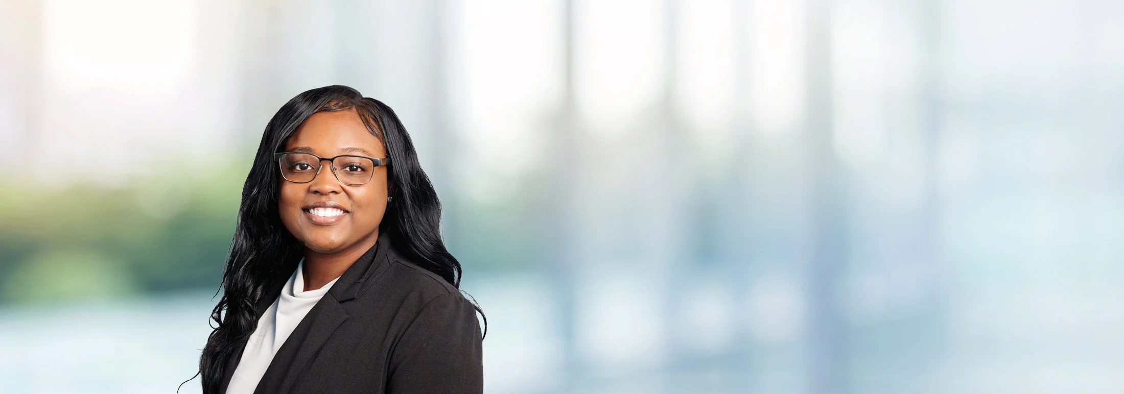 A photo of attorney Tiara Porterfield against a softly blurred office background