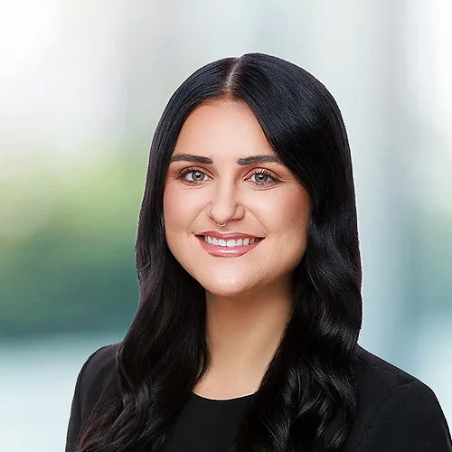 A photo of attorney Rachael McMillen against a softly blurred office background