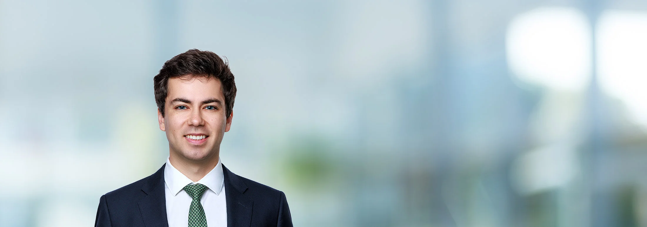 A photo of attorney Andrew Fox against a softly blurred office background