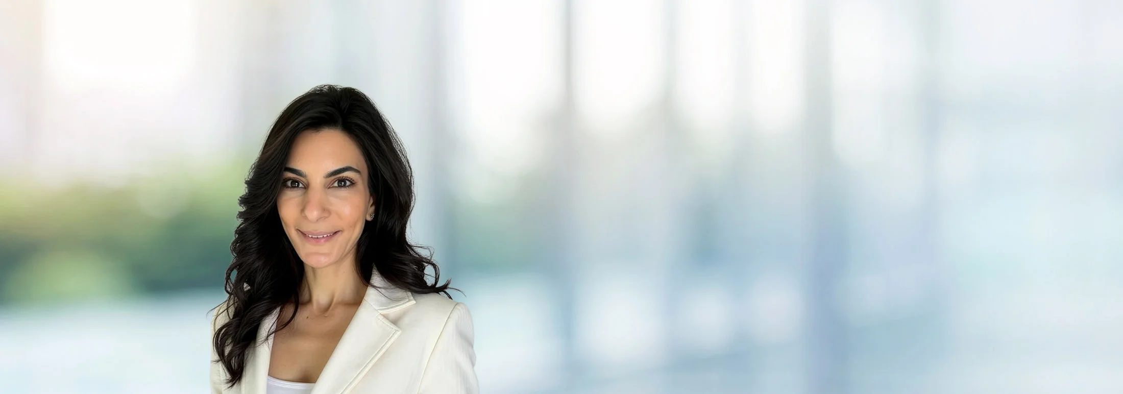 A photo of attorney Maysa Saeed against a softly blurred office background