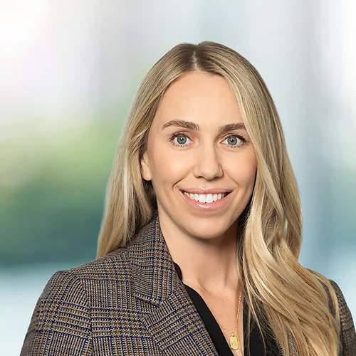 A photo of attorney Natasha Covarrubias against a softly blurred office background
