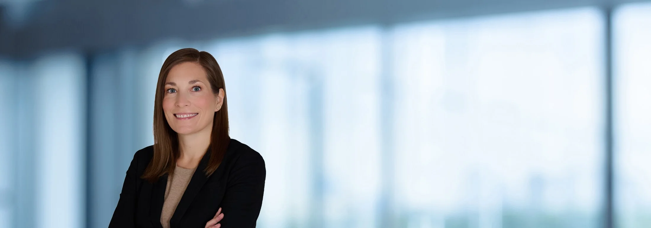 A photo of attorney Kenna Duckworth against a softly blurred office background
