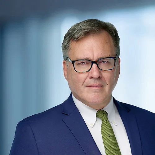 A photo of attorney Scott Oostdyk against a softly blurred office background