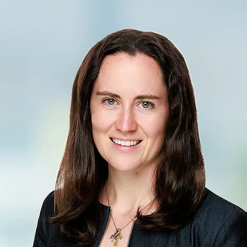 A photo of attorney Jacqueline McDonnell against a softly blurred office background