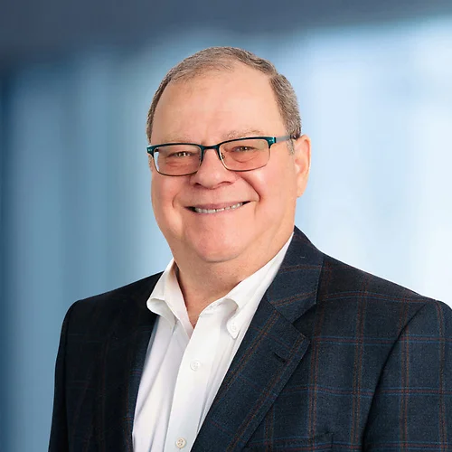 A photo of attorney, Gary Freed, against a softly blurred office background