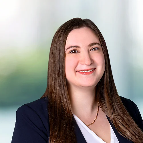 A photo of attorney, Lauren Bressman, against a softly blurred office background