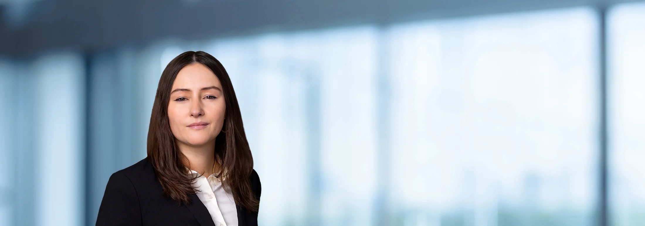 A photo of attorney, Emily Burke-Rodriguez, against a softly blurred office background.