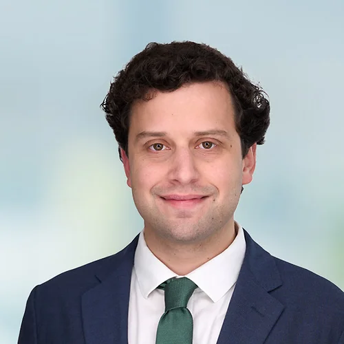 A photo of attorney Aidan Lee against a softly blurred office background