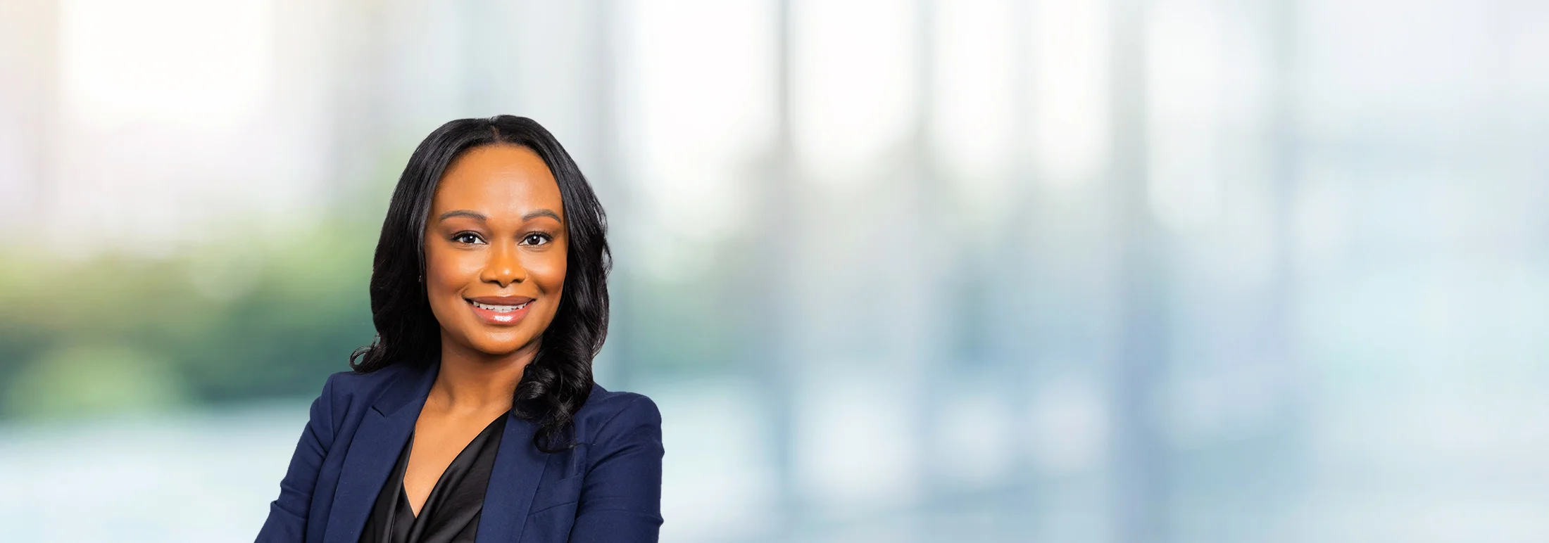 A photo of attorney, Keisha Murray, against a softly blurred office background.