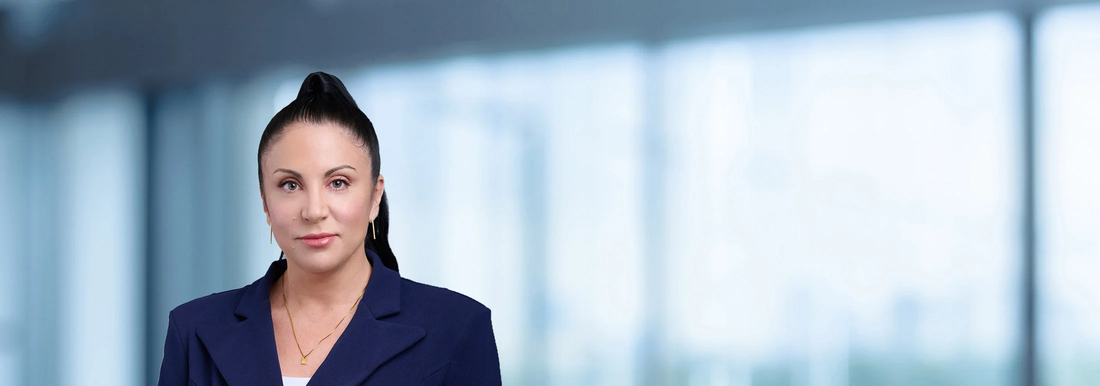A photo of attorney Wendi Boyden against a softly blurred office background