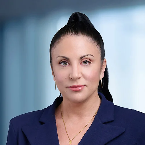 A photo of attorney Wendi Boyden against a softly blurred office background