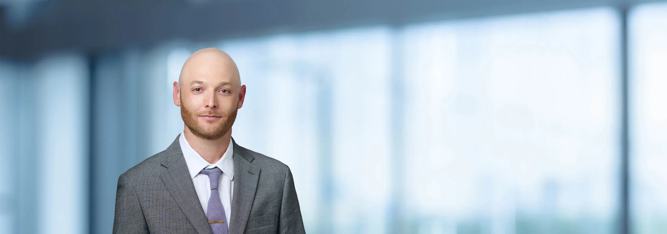 A photo of attorney David Zeetser against a softly blurred office background