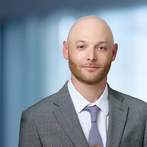 A photo of attorney David Zeetser against a softly blurred office background