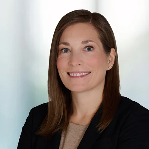 A photo of attorney Kenna Duckworth against a softly blurred office background