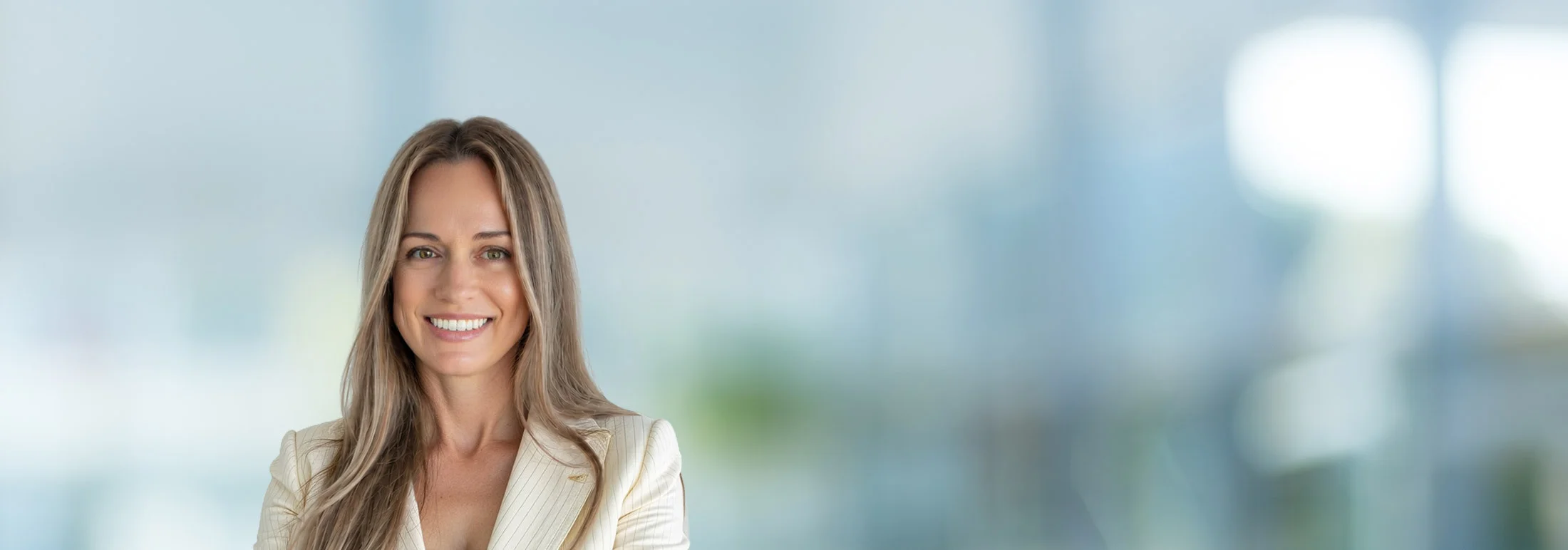 A photo of attorney Margot Parker against a softly blurred office background