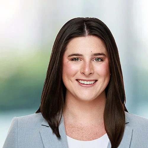 A photo of attorney Emily Callam against a softly blurred office background