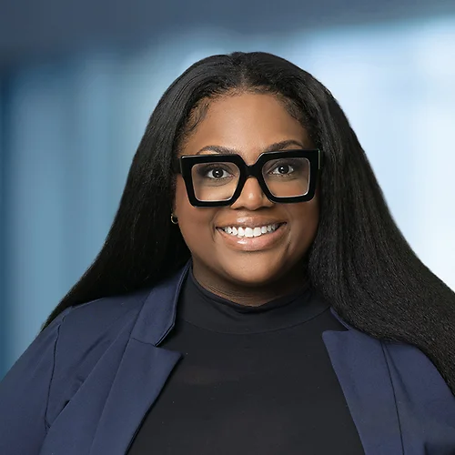 A photo of attorney, Briyana Hood, against a softly blurred office background.
