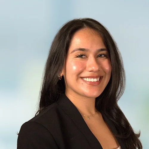A photo of attorney Bianca Montes against a softly blurred office background