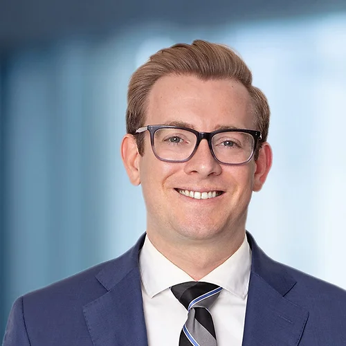 A photo of attorney Geoff Dickhaut against a softly blurred office background