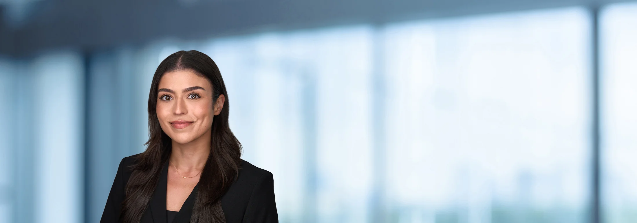 A photo of attorney Bianca Bonjean against a softly blurred office background