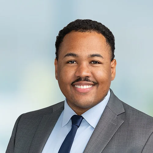 A photo of attorney Isaiah Crosby against a softly blurred office background