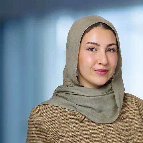 A photo of attorney Maryam Bacaloni against a softly blurred office background