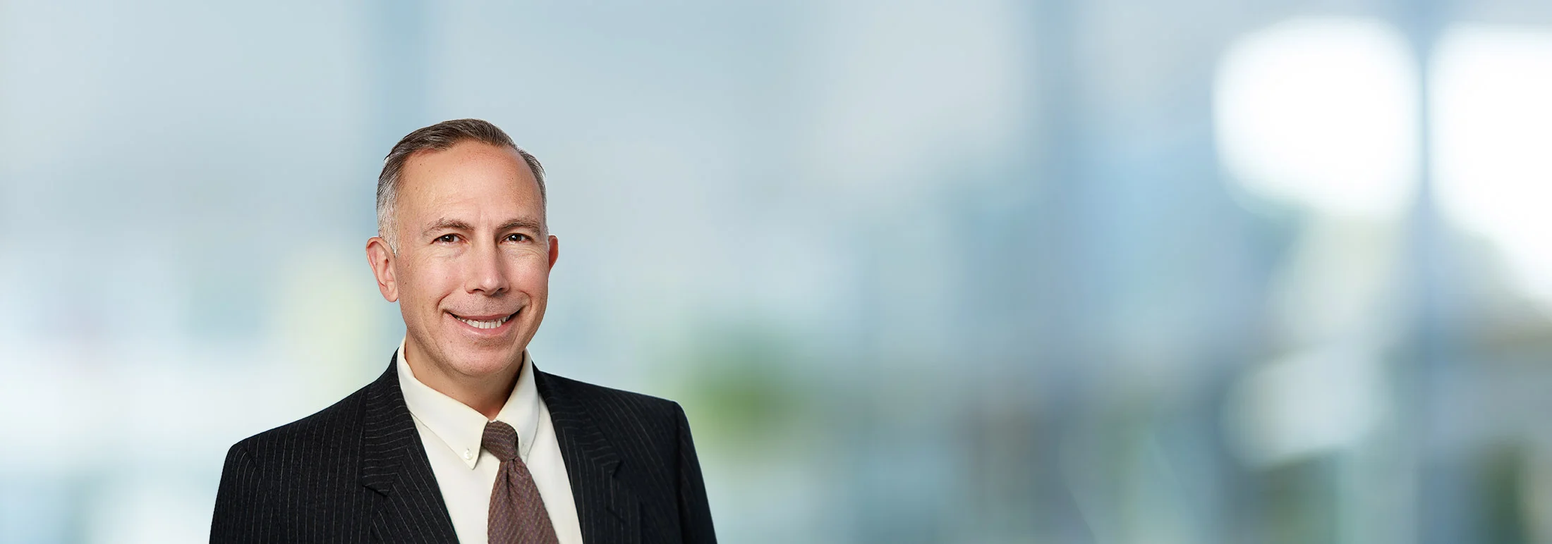 A photo of attorney Jeffrey Barger against a softly blurred office background
