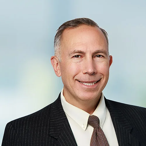 A photo of attorney Jeffrey Barger against a softly blurred office background